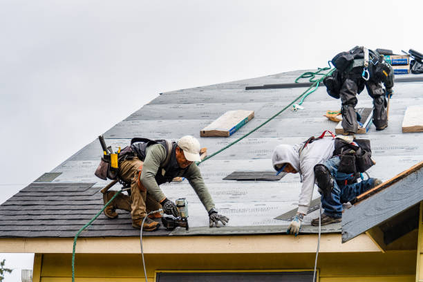 Professional Roof Replacement technician working in Northfield, VT